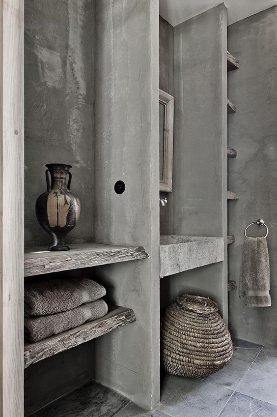 grey concrete with wood makes the bathroom interesting and rough, it stands out