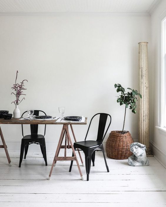 a dining space is fully uncluttered and features much negative space for a peaceful feel