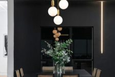 23 a moody dining space done with a cluster of pendant lamps and a neon tube light to make it more contemporary