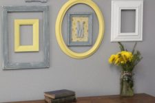 vintage rustic decor is highlighted with a group of frames in yellow, grey and white plus a monogram