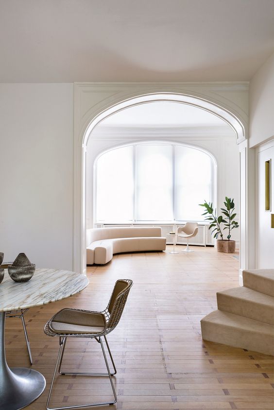 A modern light colored space with much negative space looks very spacious and welcoming