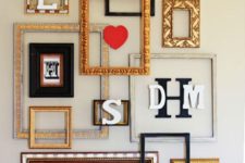 25 a super creative gallery wall using empty frames, monograms and even blooms in vases