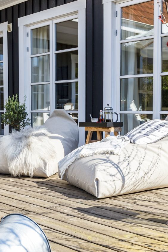 large bean bag chairs to use them instead of loungers in your outdoor space is a great and creative idea