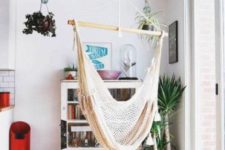 26 hang a hammock chair by the window to enjoy the views while swinging in the chair and relaxing