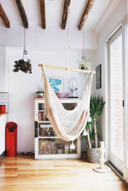 hang a hammock chair by the window to enjoy the views while swinging in the chair and relaxing