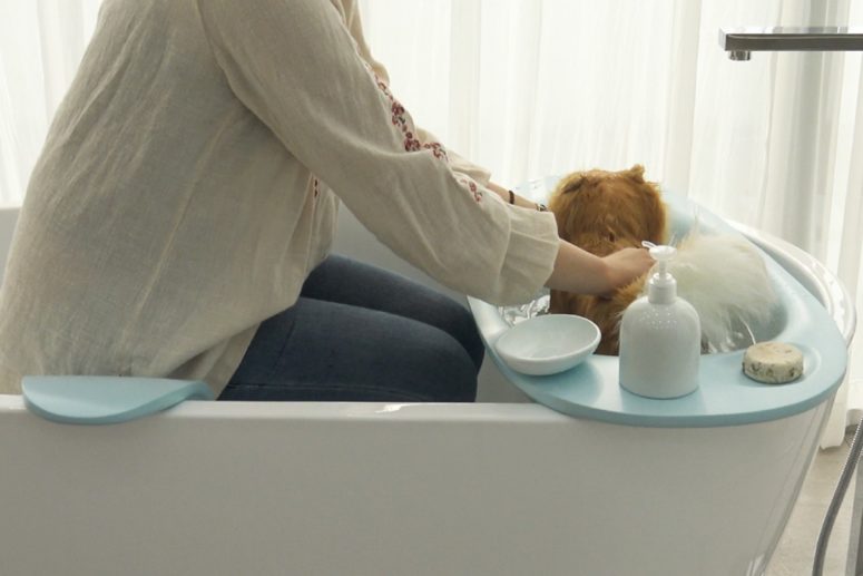 The Bath Cradle is the comfiest bathtub for a doggie and its owner to wash with comfort