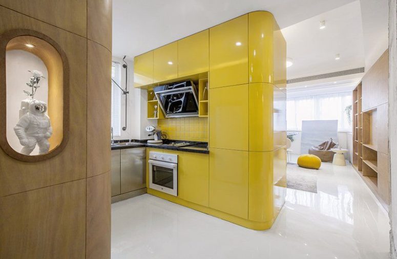 The main box is a bold yellow one, which contains kitchen cabinets and some built-in appliances