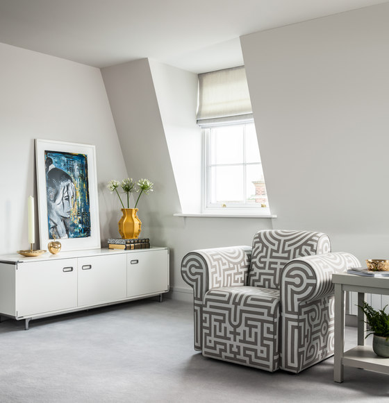 There attic windows and all the spaces are done in off-white to create a proper backdrop for bold items