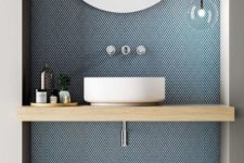 02 a blue panel on the sink wall adds color delicately and stylishly and looks very modern and cool