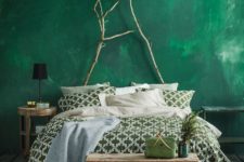 02 a bold emerald plaster wall plus branches to hint on love to nature and create a bold look