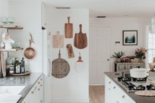 02 a coastal meets boho kitchen with a vintage boho rug, boards on the wall and neutral furniture