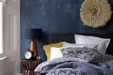 02 a navy plaster accent wall is a bold textural touch to the eclectic decor