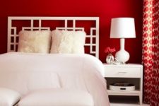 bedroom with red accent walls