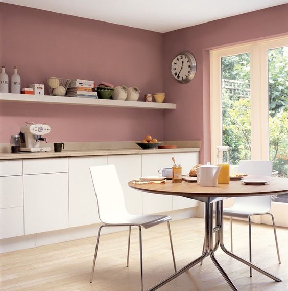 rose walls and creamy cabinets create a very chic combo and a strong girlish feel in the space