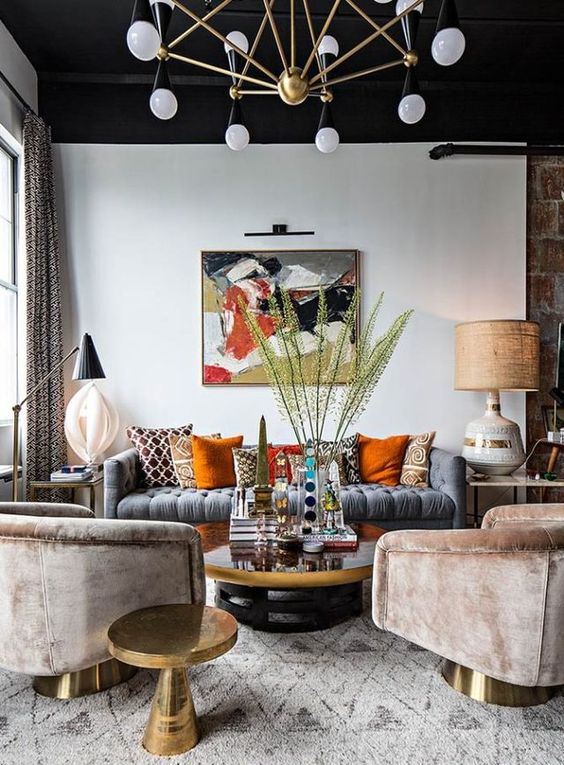 this bright and interesting living room got a couple of fall touches with orange and beige pillows