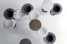 03 The piece is available in wood and marble of different shades and textures and in full or partial circles