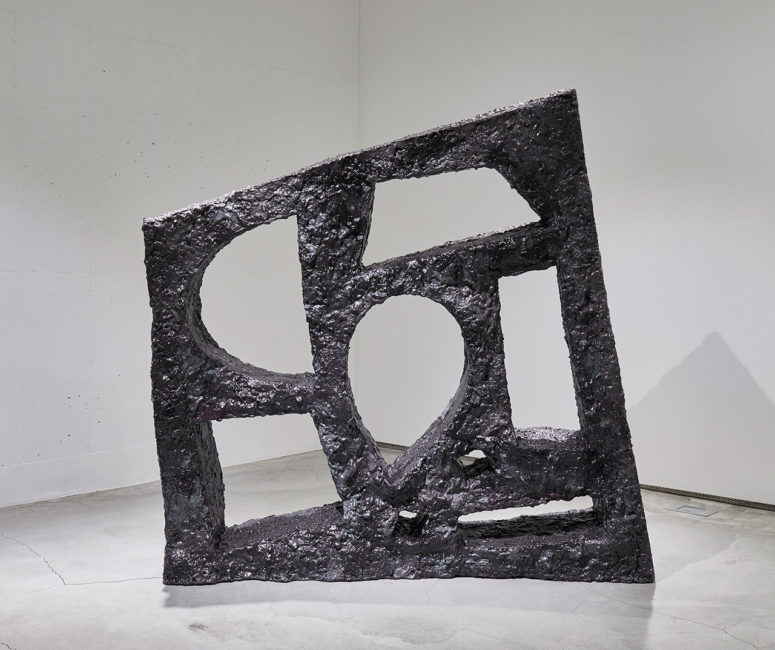 This crazily looking meteorite piece is a bookshelf