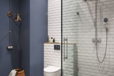 03 a matte midnight blue statement wall and a white glossy tile wall create a bold contrast