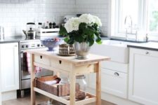 03 a mobile kitchen island with storage made of IKEA Forhoja cart in plain wood