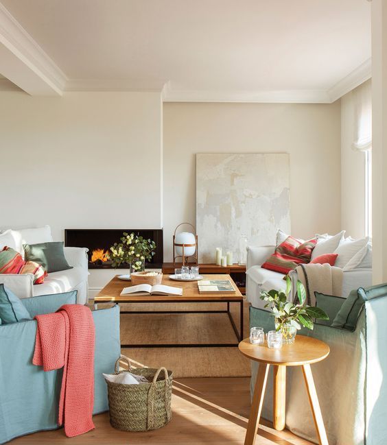 a neutral living room done with mint and coral accents will never fail