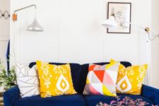 03 create a contrasting look with printed and bold pillows and a dark sofa