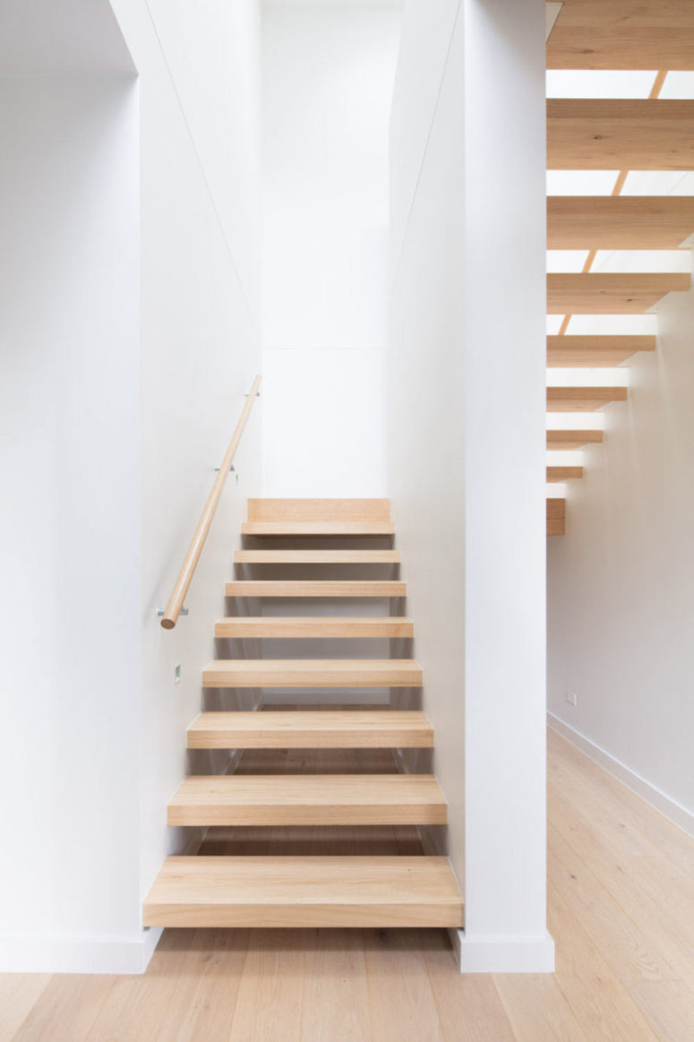 The stairs are floating ones, done of light-colored wood