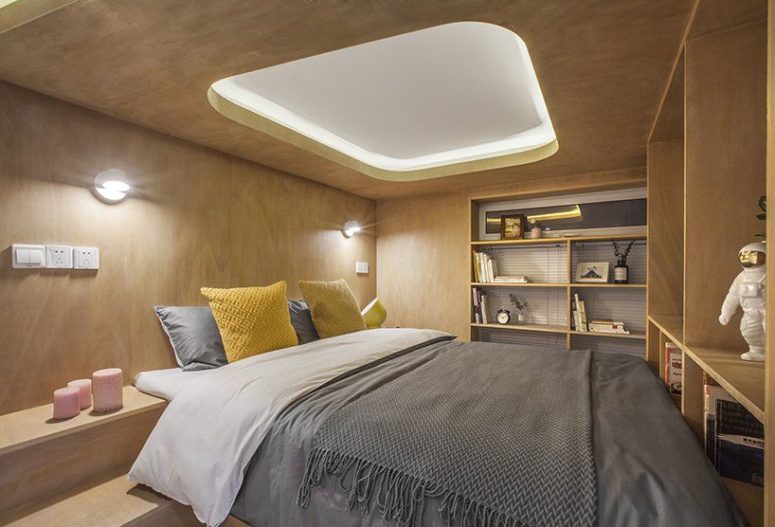 The sleeping box contains a bedroom and built-in shelves and cabinets