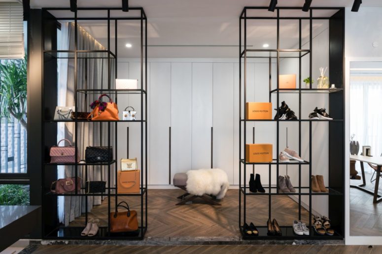 There's an airy closet with stylish and refined shelves