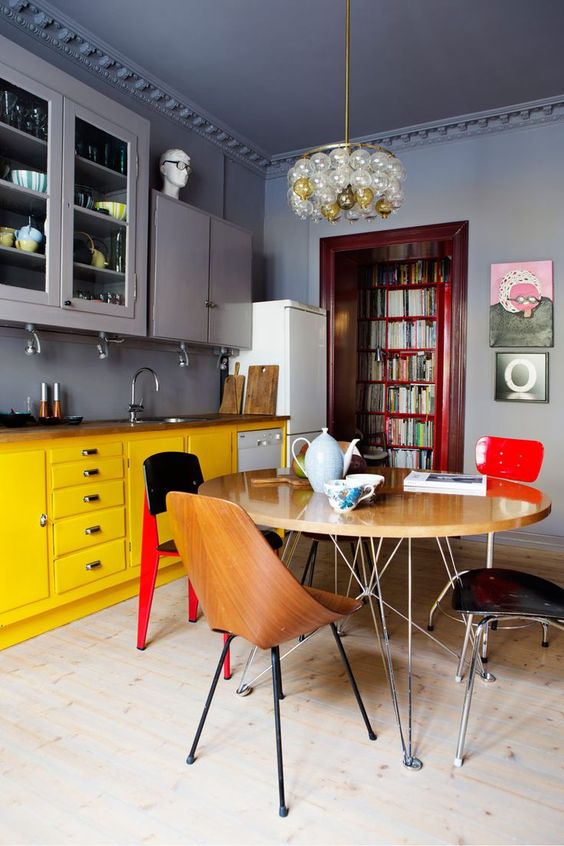 a moody space done in grey, with yellow as the secondary color and red for bold accents