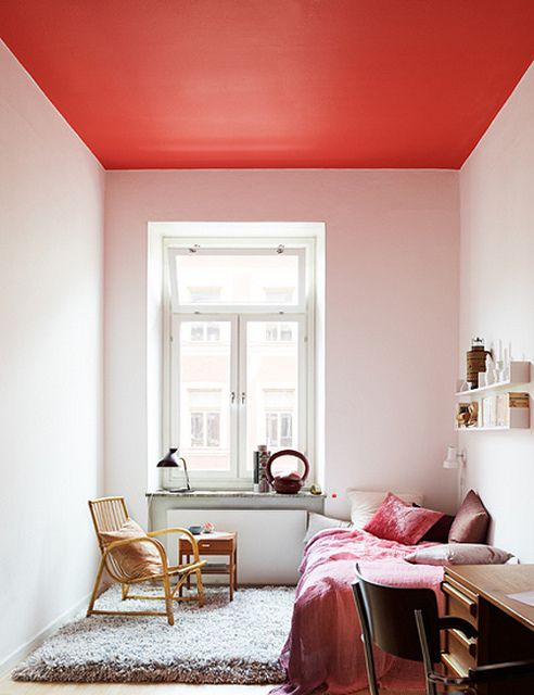 a red ceiling is a unique and bold decor feature that adds color in a non-typical way