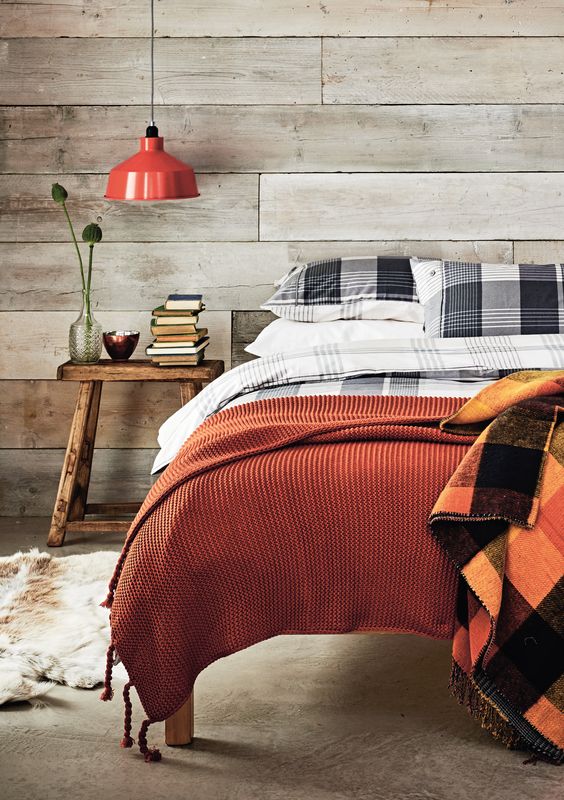 Blankets in fall colors are an easy and budget friendly way to make your bedroom fall like