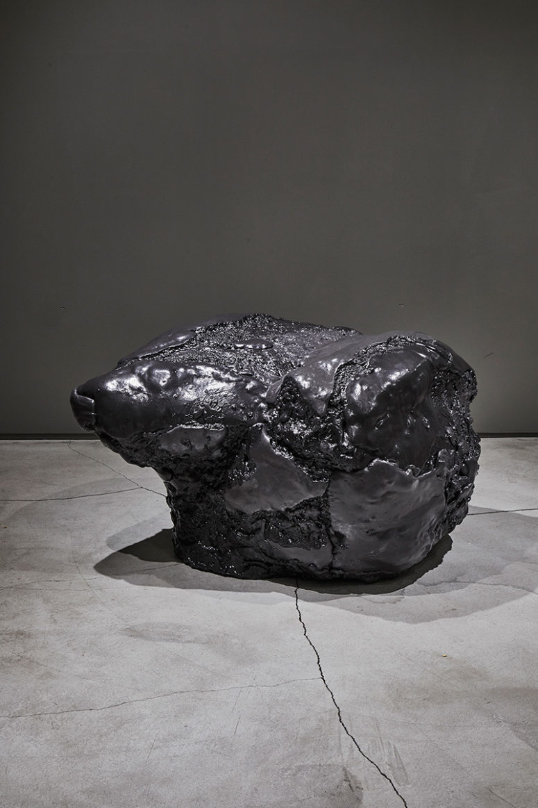 This black foam chair or seat looks like a real meteorite