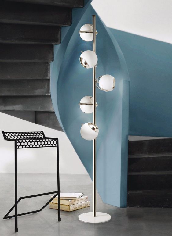 A chic mid century floor lamp with a metal base and little spheres is a great idea for a hallway