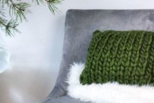 06 a faux fur throw and a chunky knit pillow add texture and coziness to the space