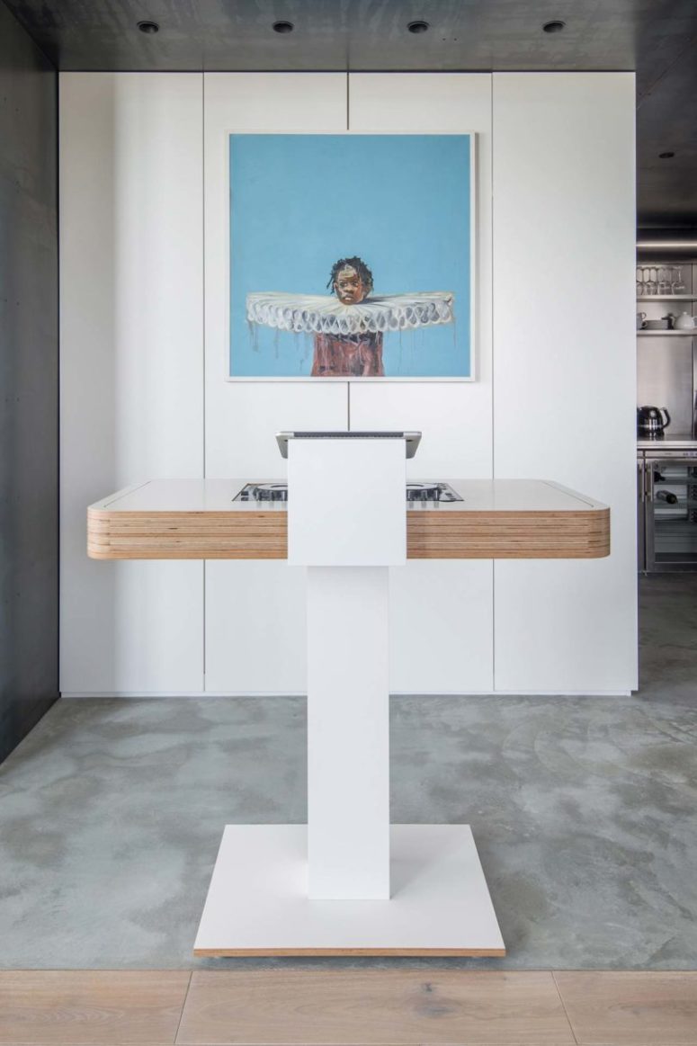 Here's a DJ stand for havign parties and an accent of a bold artwork