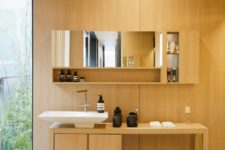 07 The bathroom features the same materials and comfy furniture with everything necessary