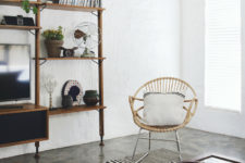 07 The shelving unit is an open one to keep the airy feeling on, and dark stained wood adds a contrasting touch