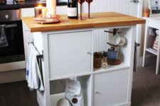 07 a comfy mobile kitchen island with open and closed storage compartments and a wooden countertop of IKEA items