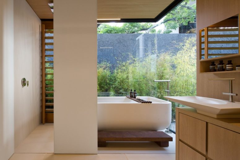 There's a bathing space with a view to the private courtyard full of greenery