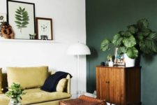 08 a chic living room with an forest green wall and a mustard sofa for a bright look