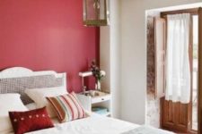 08 a red statement wall brings color to the space and spruces up the neutrals