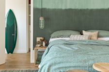 08 an ombre green statement wall and green printed bedding for a relaxing and comforting feel
