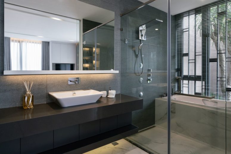 The bathrooms are open and airy, done in modern style with large mirrors