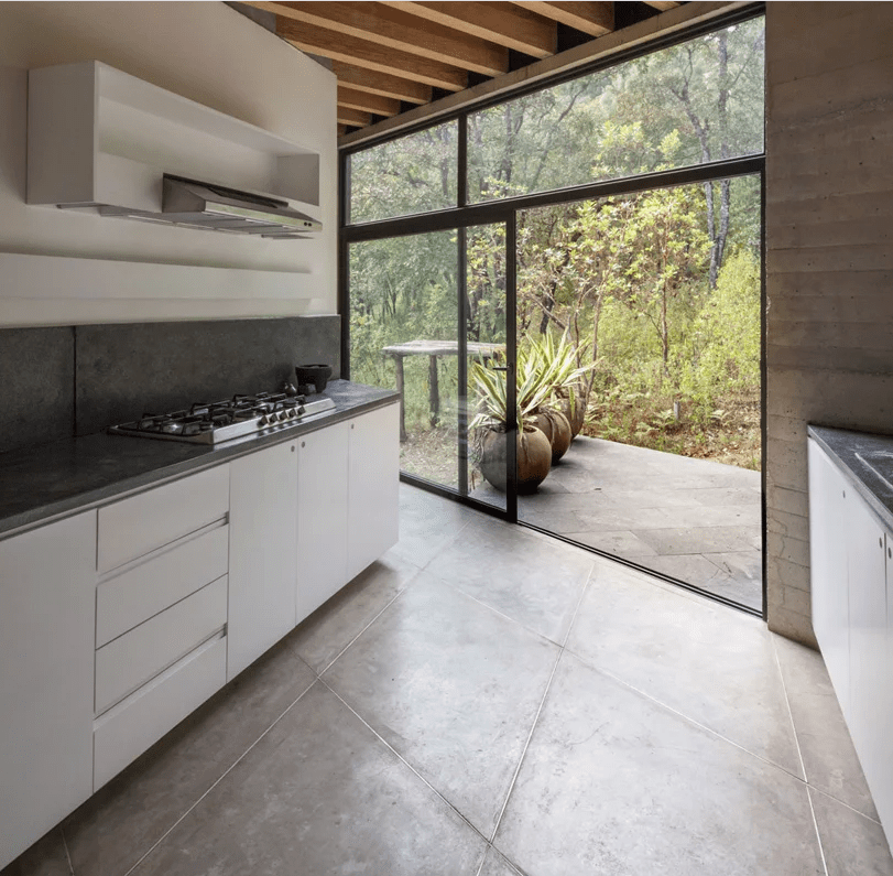 The kitchen can be also opened to outdoors with a sliding door