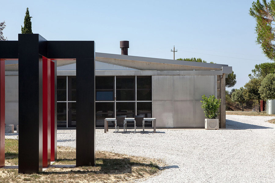 This is how the house looks outdoors, and a gravel backyard adds to its industrial nature