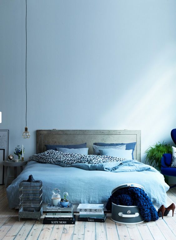a light blue wall and matching bedding easily create a comforting ambience