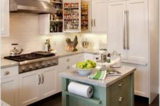 09 a tiny green kitchen island on casters with drawers and holders plus a stone countertop
