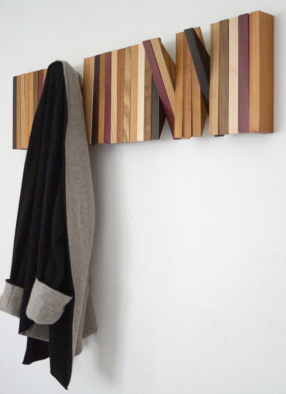 a colorful wall unit of wooden planks that can be used when you want or hidden when not in need
