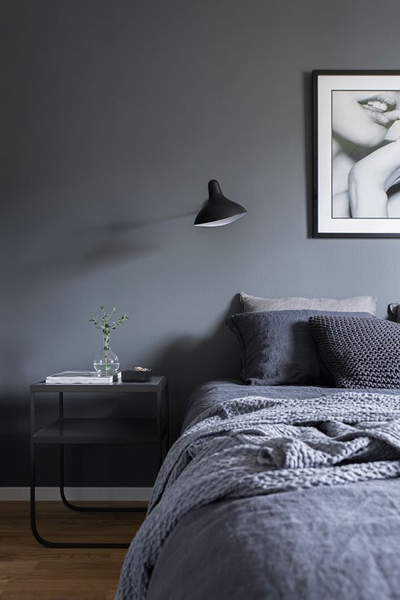 combine greys and black for creating a trendy moody space, add textures with blankets