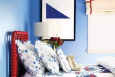 11 a bright red bed is a statement in a blue bedroom and an interesting color touch